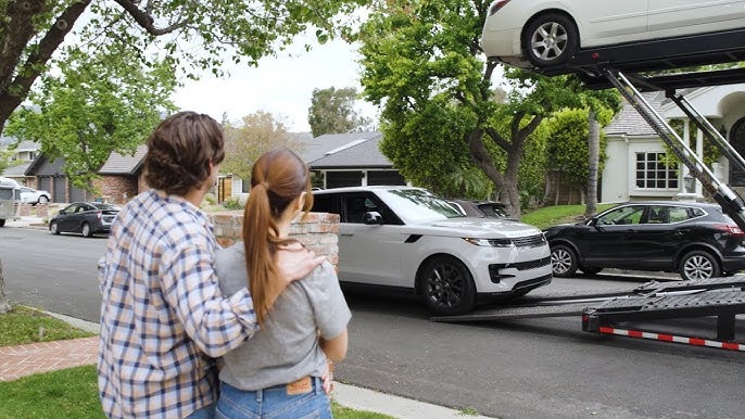Couple preparing vehicle for door-to-door auto transport