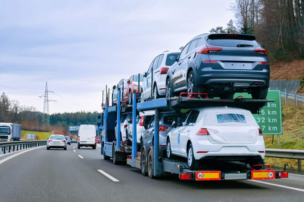 Car carrier truck transporting vehicles on highway