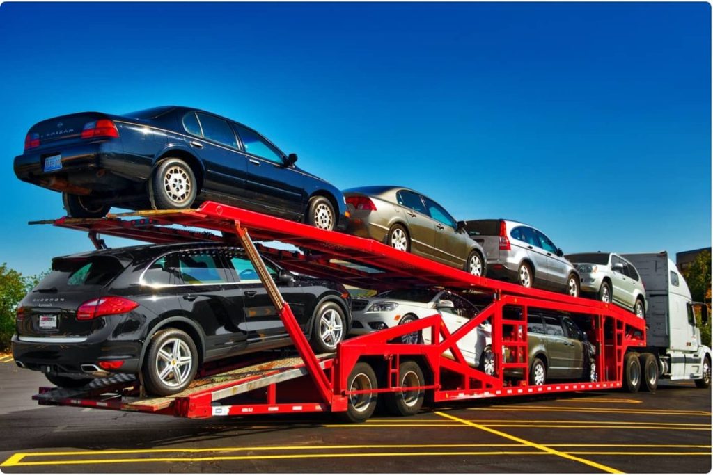 Open car hauler transporting multiple vehicles nationwide